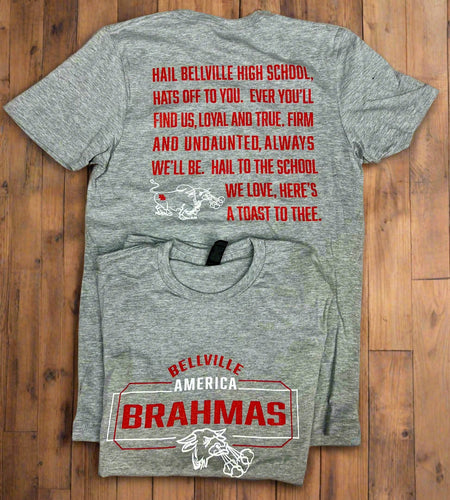 Gray t-shirt with red text and graphics on a wooden surface